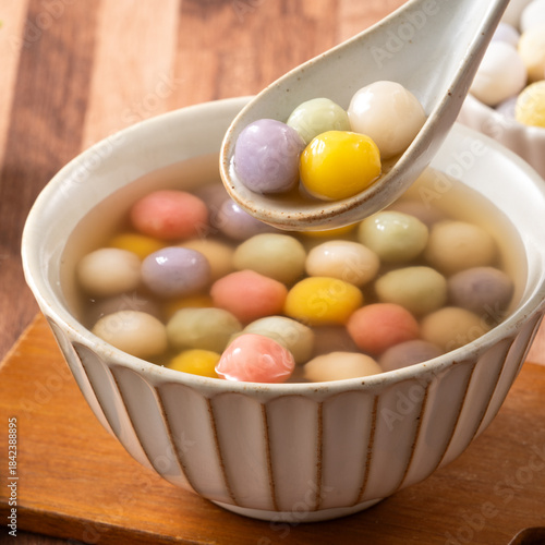 Colorful sweet glutinous rice balls tangyuan in sweet ginger syrup soup