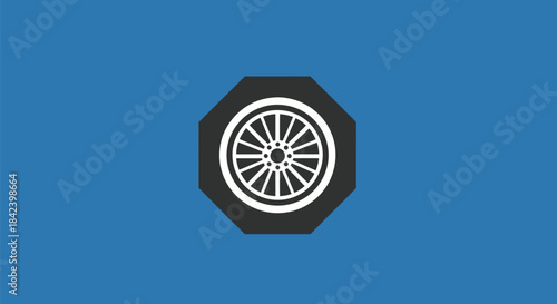 A white car wheel design with spokes on a black octagon on blue background