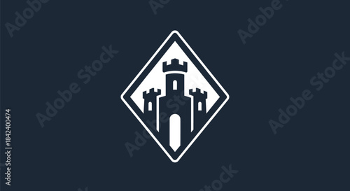 A fortress crest, white against a dark background, in a diamond shape