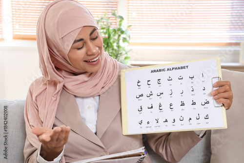 Young Muslim woman with Ara...