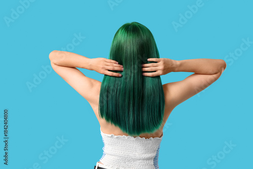 Young woman with green hair...