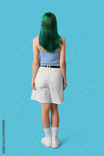 Young woman with green hair...