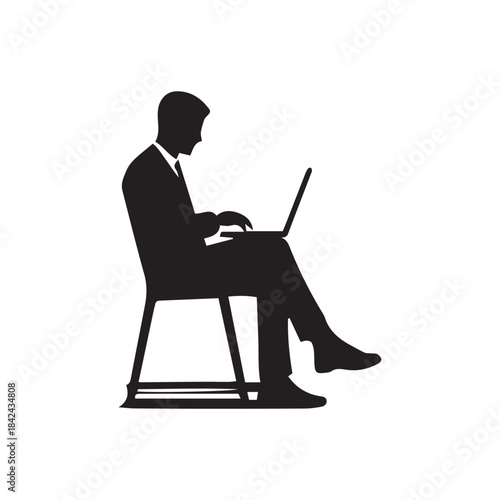 silhouette of a man working on laptop