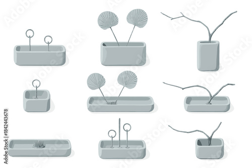 Decorative gray vases with unique designs displaying simple natural elements for minimalistic decor