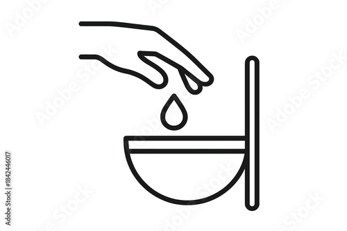 Hand dropping a liquid sample droplet into a small laboratory testing bowl