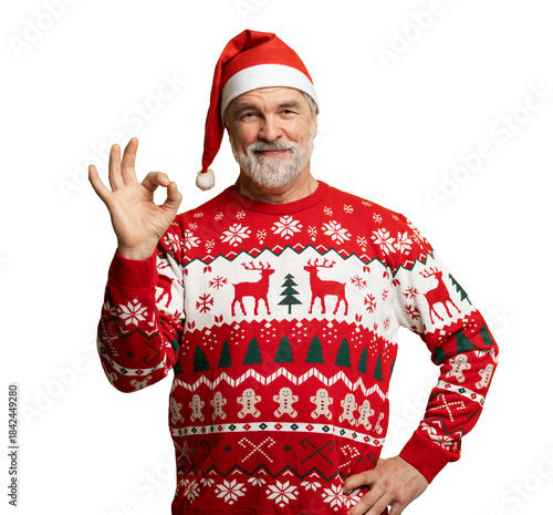 Happy charming positive mature man make okay sign recommend, wear knitted christmas sweater and santa hat isolated on transparent background