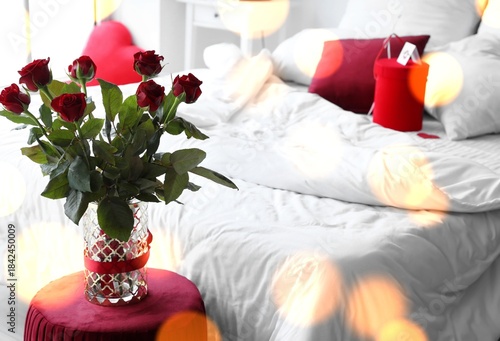 Bouquet of red roses in bed...