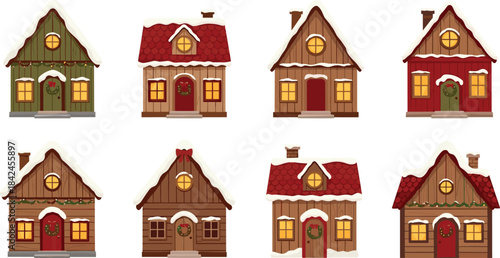 Collection of eight charming snow-covered wooden houses with Christmas decorations