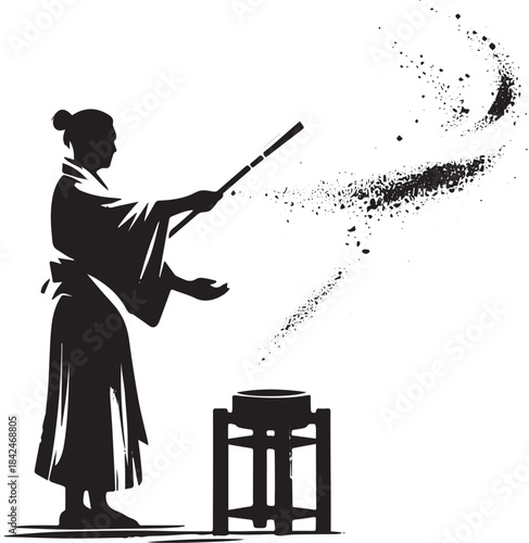 Silhouette of a person dispersing particles in a solemn, zen ill