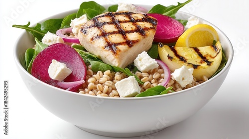 Grilled chicken salad with feta cheese lemon on spinach bed