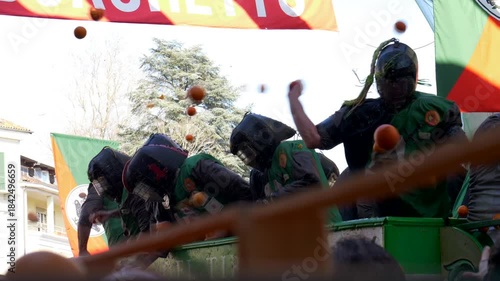 Italy, Ivrea, 03-02-2025. Violent orange battle at the Historical Ivrea carnival. Super Slow motion 4K