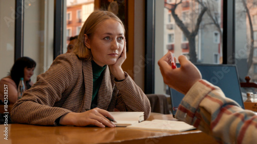 Young woman talking and gesturing, engaged in a lively conversation