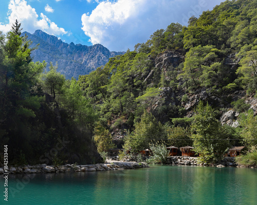Small pond in the mountains with turquoise water in Goynuk canyon,  Turkey. Emerald lake in the forest surround mountains.