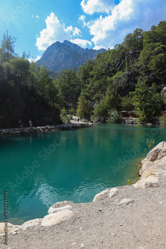 Small pond in the mountains with turquoise water in Goynuk canyon,  Turkey. Emerald lake in the forest surround mountains.