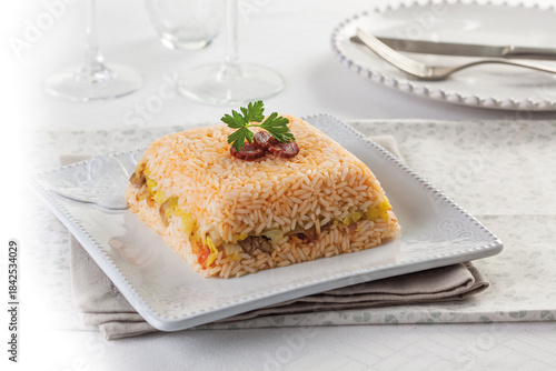 Baked rice with chorizo ​​and sausage stuffing with seasonal vegetables.