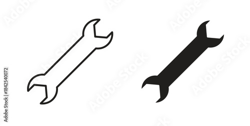 Wrench icon in line design and solid black and white colors for designs