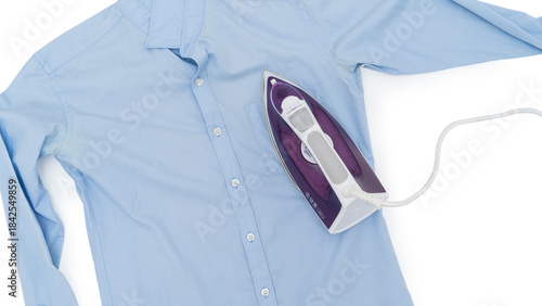 Top view of a purple electric iron placed on a light blue shirt while ironing