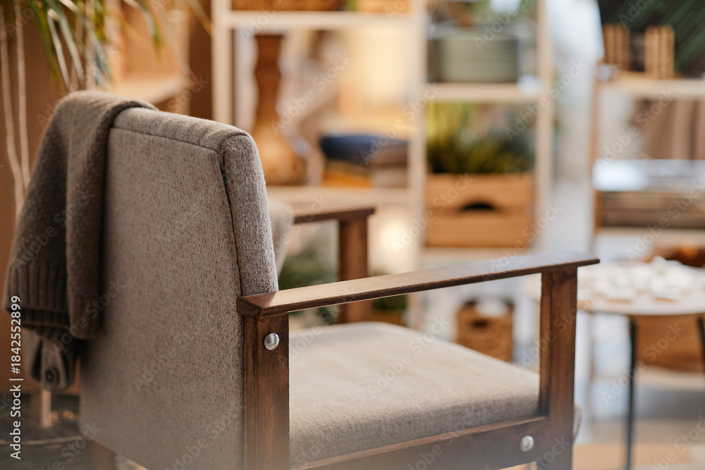 Obraz premium Empty armchair standing in nursing home interior with soft focus on background, suggesting waiting area or relaxation space for seniors, no people visible in scene