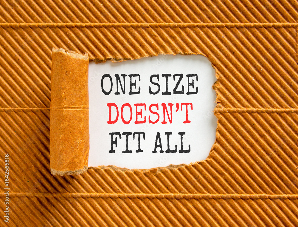 Fototapeta premium One size does not fit all symbol. Concept words One size does not fit all on beautiful white paper. Beautiful brown paper background. Business one size does not fit all concept. Copy space.