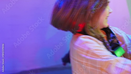 Child playing hide and seek in colorful light space