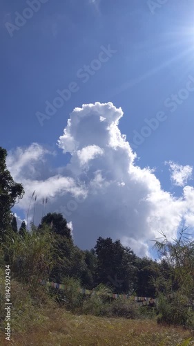 Dramatic White clouds moving in blue sky time laps symbolising weather change natural freedom and calm atmosphere.