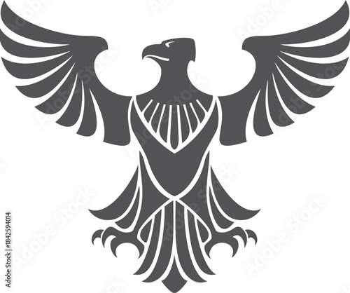 A black and white eagle with its wings spread out