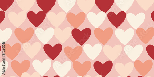 Seamless romantic heart pattern in varying shades of red, pink, and cream, perfect for Valentine's Day or love-themed designs and backgrounds