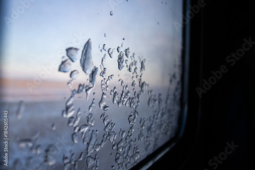 Window view Inside Train, Winter Travel Scene. Seasonal Travel Concept.