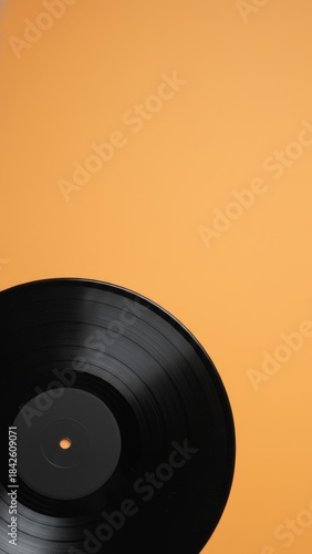 Vintage Vinyl Record on Orange Background with Copy Space - Retro Music Nostalgia Ecommerce Concept