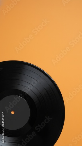 Vintage Vinyl Record on Vibrant Orange Background with Copy Space for Ecommerce - Music Nostalgia Concept