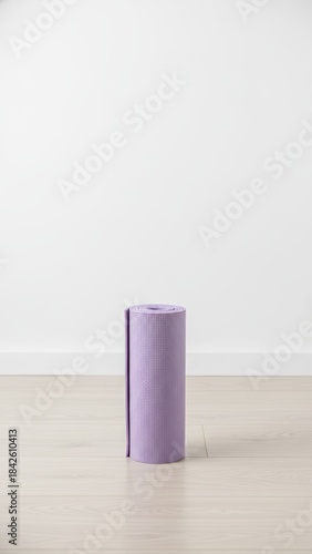 Serene Lavender Yoga Mat Vertical Composition on Wooden Floor Against White Wall for Fitness and Wellness Concept