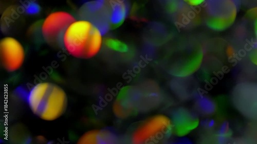 Multicolor Bokeh Seamless Loop. Festive abstract background of colorful glowing lights gently drifting and sparkling.	