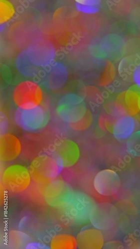 Abstract Colorful Bokeh Backgroun. Festive abstract background of colorful glowing lights gently drifting and sparkling.	
