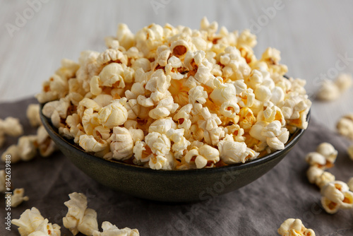 Homemade Salty Popcorn in a Bowl, low angle view.