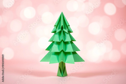 Intricate Origami Christmas Tree on a Soft Pink Bokeh Background