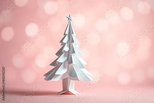 Delicate Origami Christmas Tree against a Soft Pink Bokeh Background