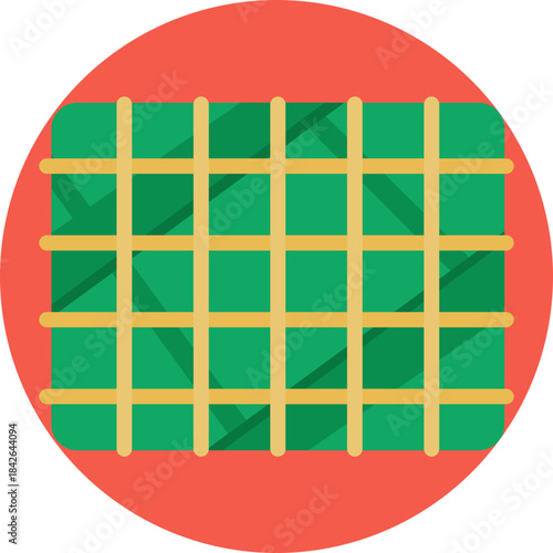 Traditional Vietnamese square sticky rice cake wrapped in green leaves, eaten during Lunar New Year.