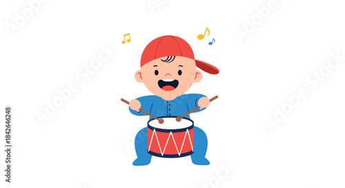 A joyful baby boy wearing a blue outfit and a red baseball cap plays a red toy drum with enthusiasm and a happy expression.