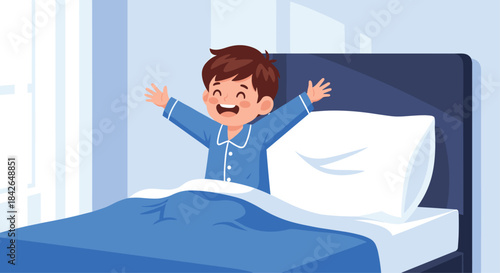 A happy young boy in blue pajamas wakes up refreshed in his bed, stretching his arms out wide to greet the new morning.