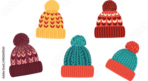 A vibrant and cozy collection of five knitted winter hats with large pom-poms and colorful heart and chevron patterns.