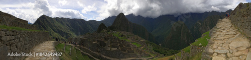 Ancient Inca citadel of Machu Picchu in the Andes Mountains of Peru featuring stone ruins and Huayna Picchu peak