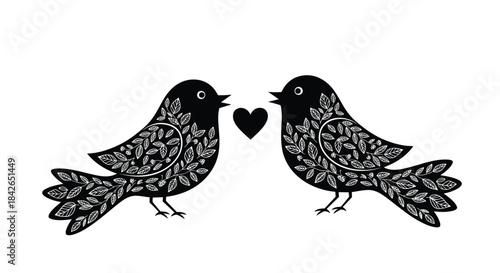 Elegant black and white silhouette of two love birds with intricate floral patterns facing each other with a heart between them.