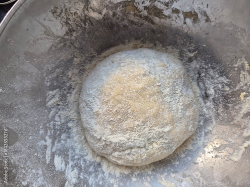 Evocative image of homemade pizza dough in Italy made with flour, salt, water, and brewer's yeast
