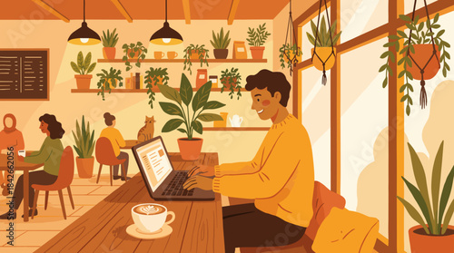 Smiling young man working on his laptop with a cup of coffee in a cozy, plant-filled cafe with warm lighting and other patrons in the background