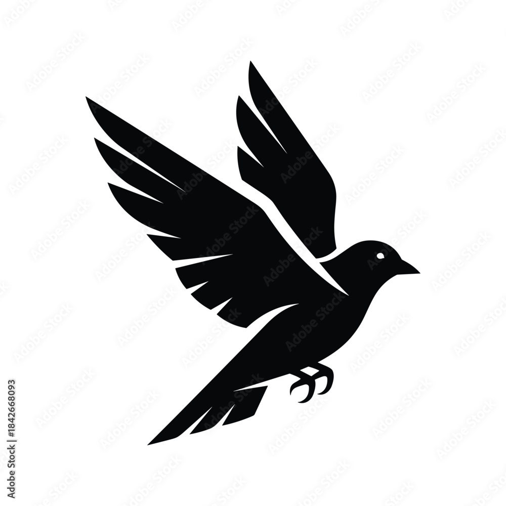 Fototapeta premium Silhouette of a black bird in flight with its wings spread, isolated on