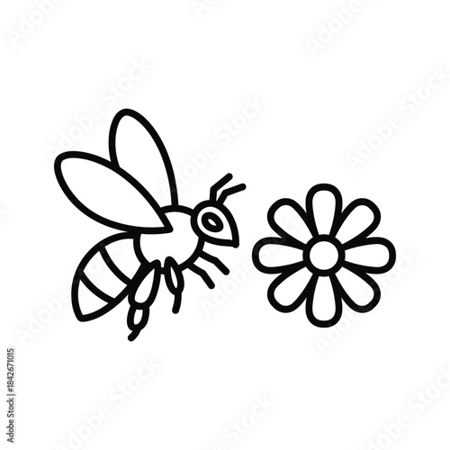 Bee flying towards flower
