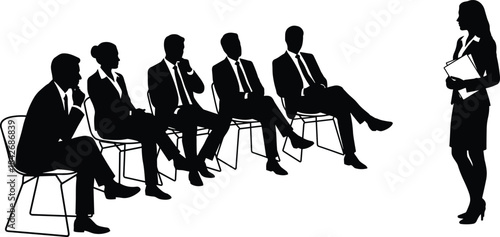 Businesswoman presenting to group of seated business professionals during corporate meeting or training session silhouette