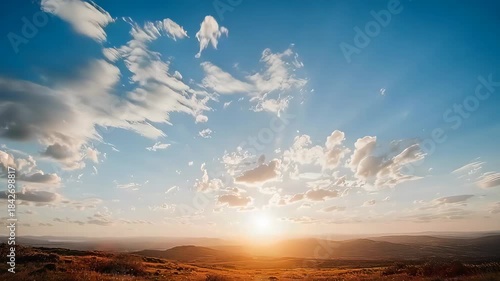 Breathtaking Sunset Over Expansive Landscape with Dynamic Cloud Formations and Golden Hour Glow.