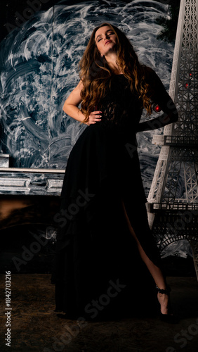 The girl in a delicate black dress near the tower of the elf.