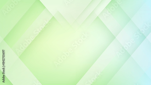 Abstract geometric background with overlapping green and blue diamond shapes
